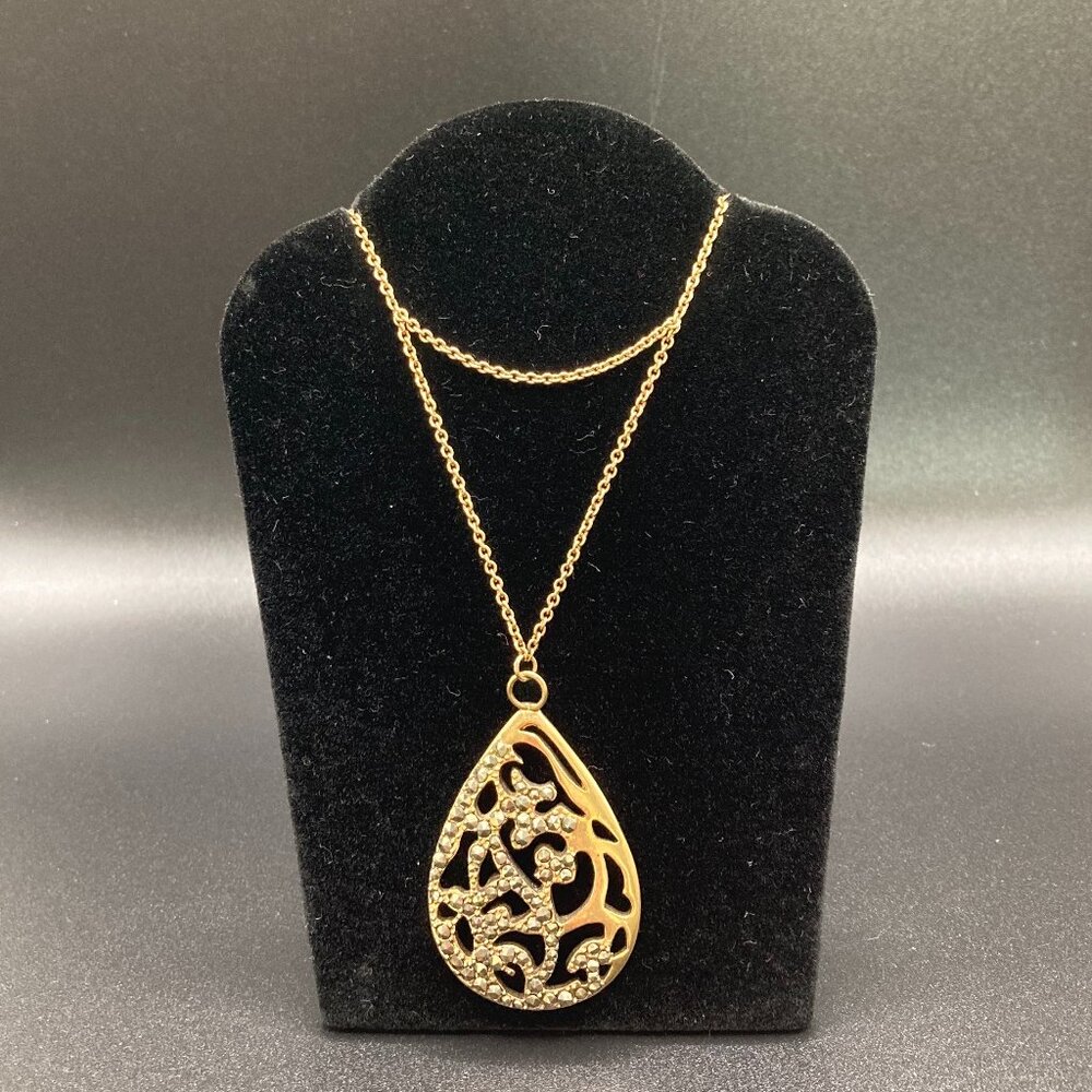 Elegant Kenneth Cole Gold Tone Pendant Necklace Inset with Sparkly Marcasite